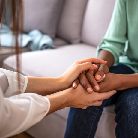 African,Psychologist,Hold,Hands,Of,Girl,Patient,,Close,Up.,Teenage